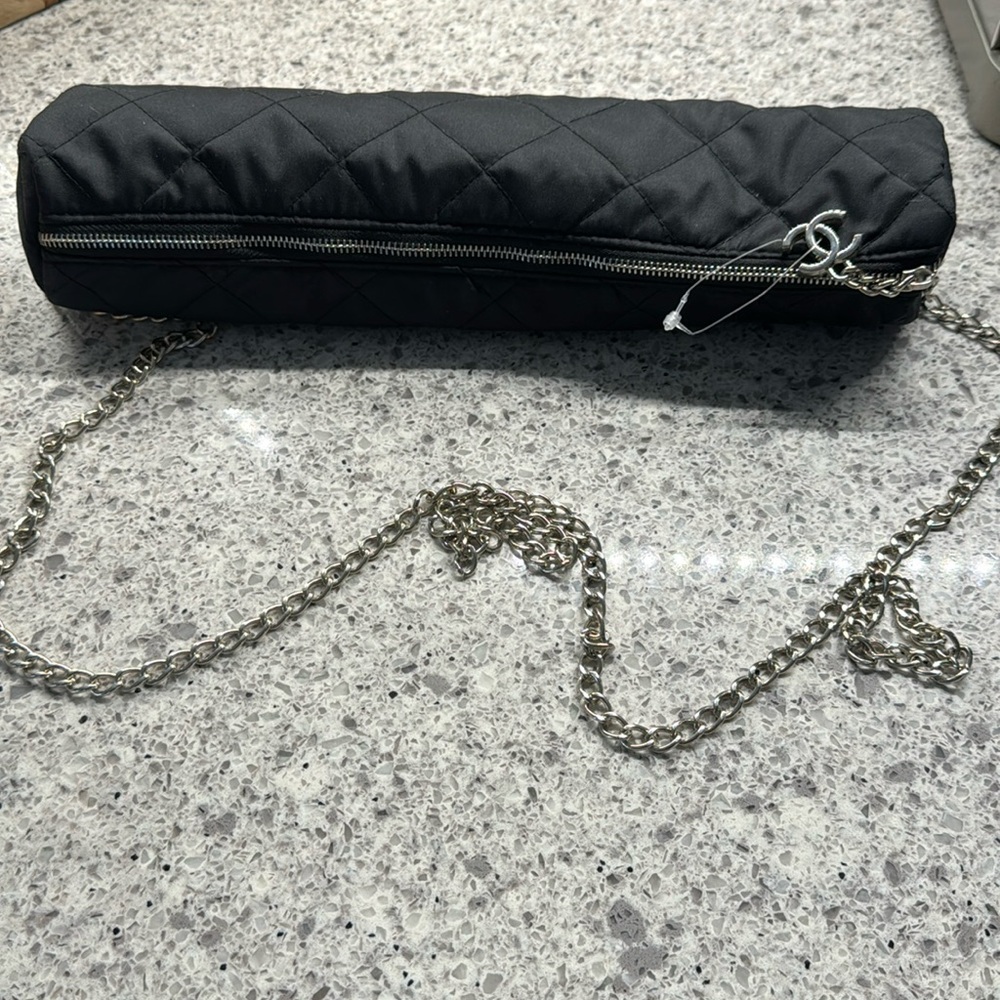 Chanel umbrella cream and black mostly cream with black pattern.